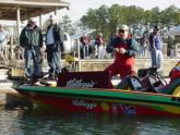 Pro Shaw Grigsby test out his rod and reel from the deck of his official Kellogg