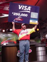 Dion Hibdon of Stover, Mo., shows off a check for $250,000 - the first prize for winning the FLW Championship at Shreveport, La., in 2000