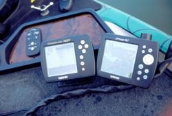 A GPS unit is mounted next to a depth finder display screen on the front deck of Scott Martin