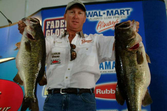 Pro Mike Surman proudly displays two monster bass en route to a first-place finish.