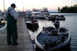 Pro Jim Moynagh of Carver, Minn., stares at the empty boats docked at the marina during the delay. Moynagh, who finished yesterday