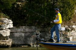 Pro Steve Kennedy fishes near a rock wall in Friday