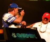 Co-angler Frank Divis Sr. directs a humorous 'bring it on' gesture toward the ultimate co-angler winner at Kentucky Lake, Stephen Tosh Jr.
