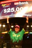 Pro Brent Ehrler of Redlands, Calif., shows off his first-place check after winning the 2004 EverStart Championship on Lake Cumberland. 