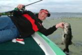 The fruits of the king's labor: an 8-pound Okeechobee lunker that J.T. Kenney flipped from thick matted hydrilla.