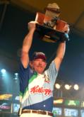 Alvin Shaw hoists his first winner's trophy in 10 years of competition on the FLW Tour.