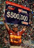 George Cochran of Hot Springs, Ark., hoists the $500,000 winner's check at the 2005 Forrest L. Wood Championship at Lake Hamilton.