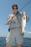 Sandy Melvin shows of a multi-spotted keeper redfish caught from Charlotte Harbor