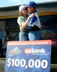 Jeff Ryan embraces his wife after his first victory on tour.