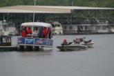 The FLW Tour staff huddles under the pontoon awning as they check in competitors on the morning of day one.