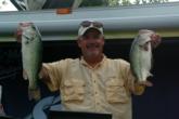 No. 2 co-angler Richard Meuth displays two of the five bass he caught today. His limit weighed 18 pounds, 9 ounces.