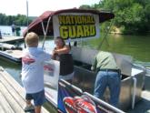 Ohio Federation volunteers manage fish care on the National Guard live-release boat.