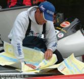 Jim Moynagh, No. 2 in the points race, studies the maps before crucial day two.
