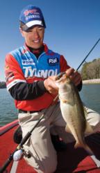 Gabe Bolivar of Ramona, Calif., lands a Pickwick bass prior to the Wal-Mart FLW Tour event there in 2006.