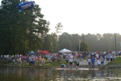 Fans gather at Lakeside Park in Pell City, Ala., to send off the 48 championship boats onto Logan Martin Lake Wednesday morning.