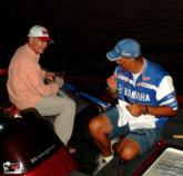 Co-angler leader Marty Barski chats with pro leader William Davis as the two prepare tackle for day four.