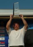 David Junk displays his trophy for winning the Stren Series Midwest Division event on the Mississippi River.