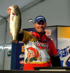Pro leader Dave Lefebre shows off his biggest bass from day two on Lake Travis.