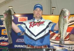 Third-place pro Harmon Davis holds up his two biggest bass from day one.