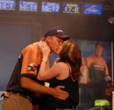 Andy Morgan gets victory kiss from his wife, Missy.