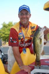 Folgers pro Scott Suggs shows off one of his Ouachita bass before weighing in on day one.