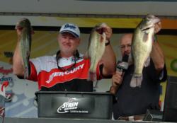 Pro Mark Dunbar shows off his 21-pound, 3-ounce limit, the heaviest of the tournament thus far.