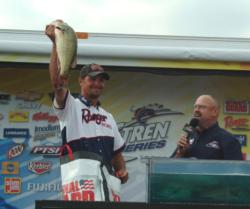 Pro winner Jason Christie holds up his biggest bass from day four on Lake of the Ozarks.