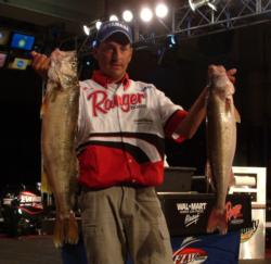 John Gillman holds up his two biggest fish from day one at the FLW Walleye Tour Championship.