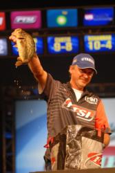 Mike Jackson shows off one of his tournament winning bass.