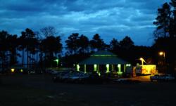 Umphrey Family Pavilion, glowing against the early dawn, hosts daily takeoffs at Sam Rayburn near Jasper, Texas.
