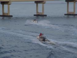 Racing under the U.S. 41 Bridge, Redfish Series anglers head to their fishing grounds with high hopes.