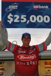 Pro Justin Kerr of Simi Valley, Calif., holds up his first-place check after winning the Stren Series event on Lake Havasu.