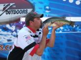 Third-place Nate Wellman shows some love for one of the bass that comprised his 17-pound, 1-ounce sack.