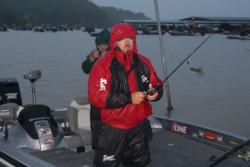 Already soaked from a morning downpour, FLW Tour pro Dan Morehead readies a flipping tube for a day of power fishing.