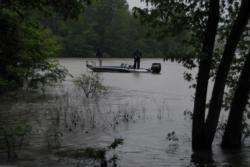An FLW Tour angler makes his first cast of the morning along a flooded bank.