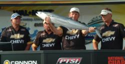 Team East Coast Sports holds up their fourth-place catch at the Sarasota FLW Kingfish Tour event.