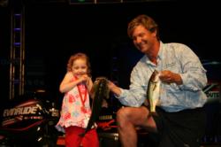 Moving into second place, Shayne Berlo had to hold his fish when his 5-year-old daughter Alana refused to help.