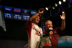 Second-place pro David Dudley and FLW Outdoors Host Charlie Evans wave to Dudley