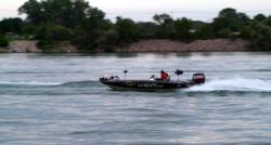 Pro Kim Stricker motors toward tourney action in his Chevy boat on the final day of the Chevy Open in Detroit.