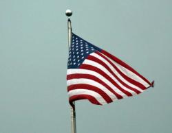 Windy conditions had the American flag flapping early in the morning on day three.