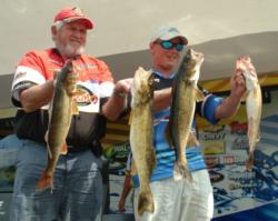 Pro Chad Schilling and co-angler Jimmy Cox hold up their day-three catch. 