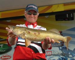 Pro Thomas Vanderweide holds up a Bays de Noc walleye he caught on day three.
