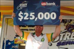 Ricky Fuqua of Effie, La., shows off his first place check after capturing first place in the Pro Division at the Stren Series event at the Red River.