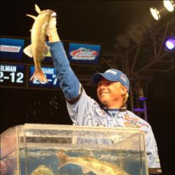 Second-place pro Robert Blosser holds up his kicker fish from day four of the Walleye Tour Championship.