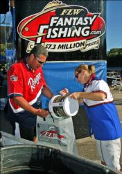 Florida pro Matt Greenblatt gets a bucket of water for his fish from Pat Deitz.