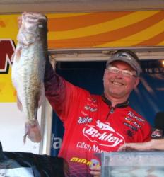 Second-place co-angler Keith Honeycutt holds up his kicker bass from day three on Falcon Lake.