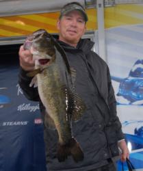 Larry Mullikin shows off the bass that not only won the big bass honors in the Co-angler Division but also brought him a $20,000 victory.