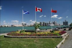 Windsor, Ontario's magnificent waterfront abuts the Detroit River as it meanders towards Motor City's downtown.