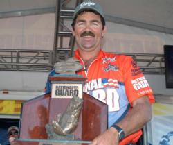 Neil Russell of Nampa, Idaho, proudly displays his first-place trophy after winning the FLW Series event on the Columbia River.