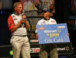 Team Castrol member Mike Surman presents a Walmart gift card to Co-Angler of the Year Dearal Rodgers.